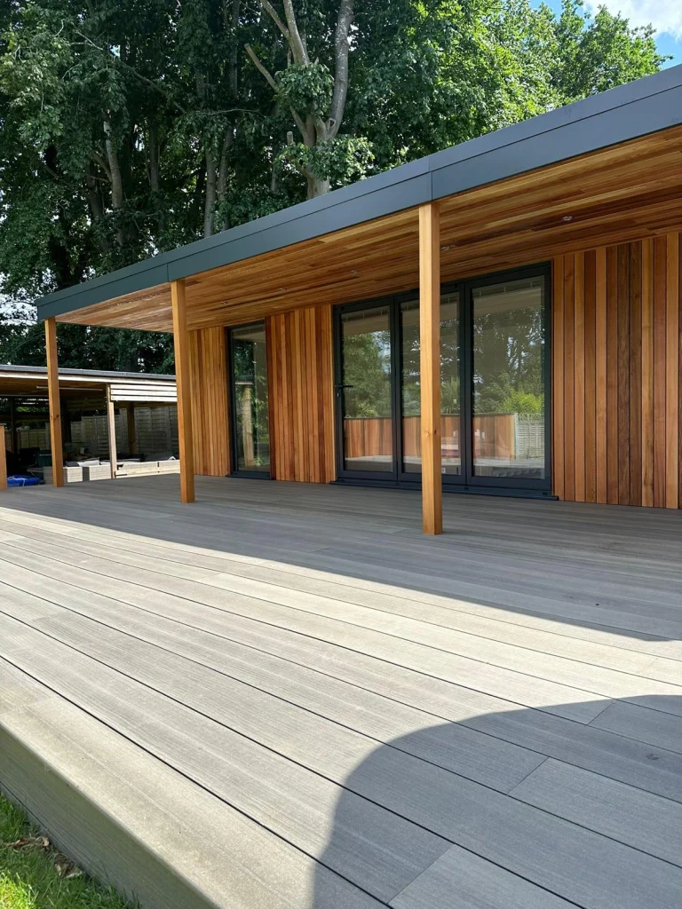 Garden room with a covered decking area and cedar cladding
