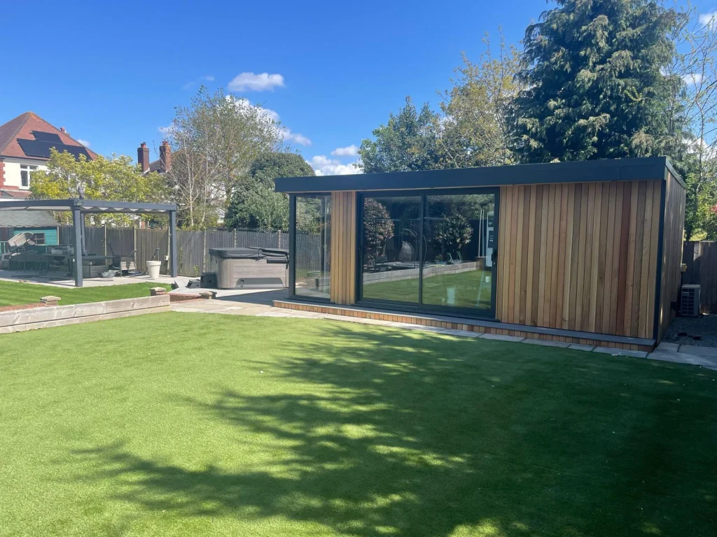 Garden room with wide sliding doors opening onto the garden