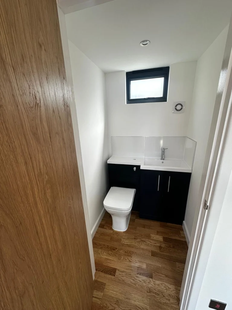 Compact shower room interior with tiled walls
